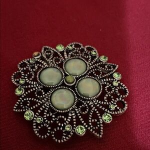 Elegant Silver and Green Brooch